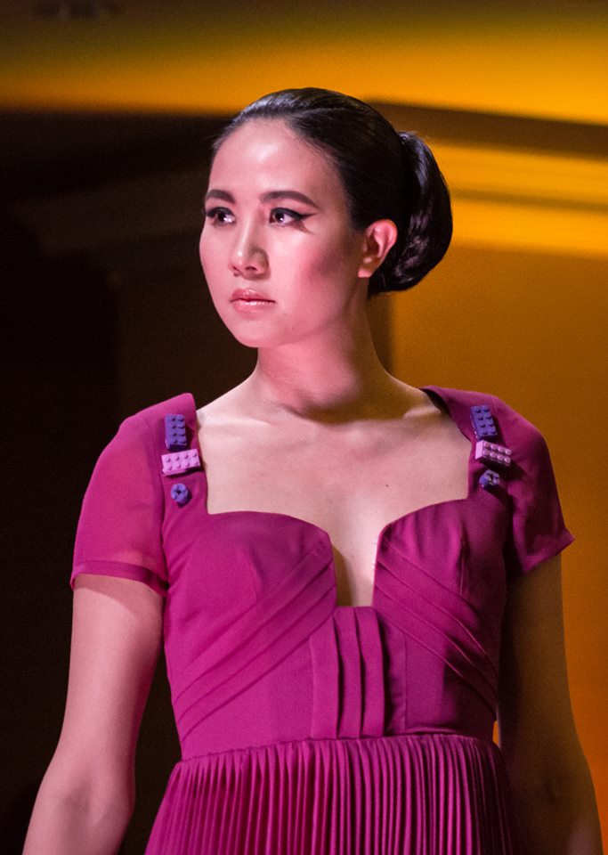 Photograph of Girl on the Runway with fushia dress with lego accents for Runway for Hope Fashion Show in 2018